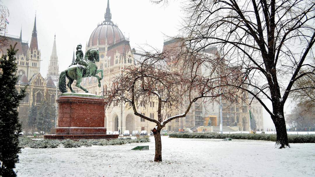 Snow-covered streets in a Hungarian town, important for weather preparation when relocating to Hungary